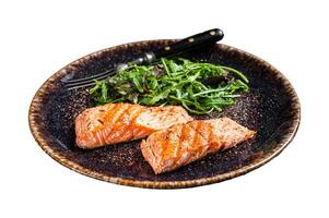 BBQ vegetarian dinner - grilled salmon fillets steaks on plate with salad. Isolated on white background. photo