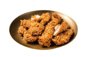 Breaded chicken strips, breast fillet meat on a plate. Isolated on white background. photo