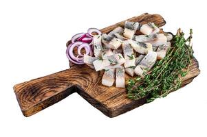 Salted herring fish sliced fillet Isolated on white background, top view. photo