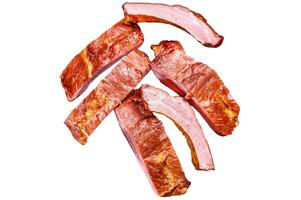 Sliced delicious smoked pork ribs in barbecue sauce. Isolated on white background. Top view. photo