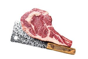 Dry aged Tomahawk rib eye steak, raw beef meat on butcher table. Isolated, white background. photo