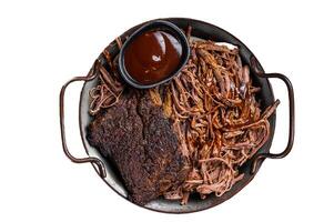 Slow Cooked Pulled Beef, Traditional meat rubbed with spices and smoked in a Texas smoker. Isolated on white background. photo