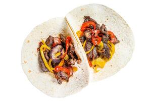 Fajitas with beef meat stripes, colored bell pepper and onions, served with tortillas and salsa. Isolated on white background, Top view. photo