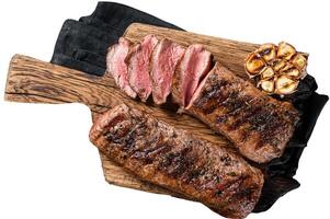 Grilled Lamb sirloin fillet meat on wooden board with herbs, mutton loin steak. Isolated on white background. photo