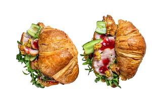 Croissant sandwich with cheese, arugula and ham. Isolated on white background. photo