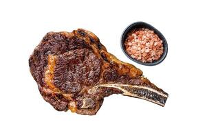 Grilled cowboy or rib eye with bone beef steak. Isolated, white background. photo