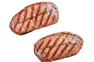 Grilled meat Top Blade steaks in a frying pan. Isolated on white background. photo