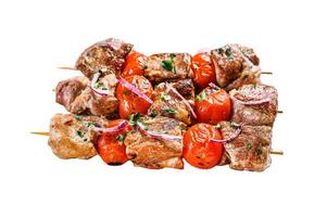 Pork kebab on skewers with tomato and pepper. Food for a picnic. Isolated on white background. Top view. photo
