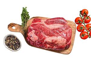 Fresh raw beef marbled steak. Chuck eye roll on a cleaver. Isolate, white background. photo