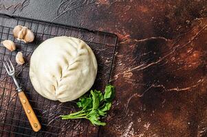 Pyan-se, Pyanse - Traditional Korean steamed pie bun with vegetable and meat. Dark background. Top view. Copy space photo