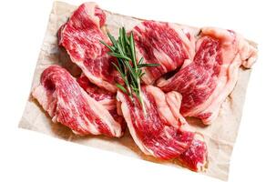 Strips of marbled beef, quick steak Isolated on white background. Top view. photo