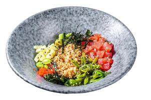 Tuna poke bowl with seaweed, avocado, cucumber, radish, sesame seeds. Isolated on white background. Top view. photo