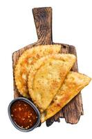 Mexican chilean food fried empanadas pie with beef meat. Isolated on white background, top view. photo