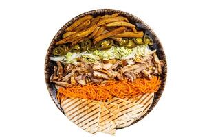 Chicken Shawarma Doner kebab on a plate with french fries, vegetables and salad. Isolated on white background. photo