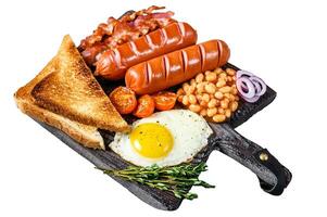 Full fry up English breakfastt with fried eggs, sausages, bacon, beans and toasts on a wooden cutting board. Isolated on white background, Top view. photo
