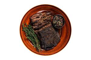 Smoked barbecue wagyu beef brisket meat. Isolated on white background. photo
