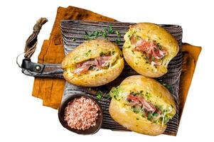 Jacket potatoes baked with cheese, herbs and butter. Isolated, white background. photo