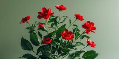 Red Flowers with Green Leaves on Green Background. photo
