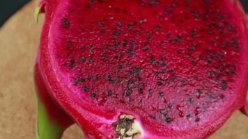 sliced dragon fruit showcasing its unique texture, rotary display video