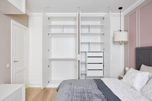 A Stylish and Modern Bedroom Design Featuring a Spacious Wardrobe for Storage Needs photo
