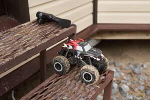 Using a Remote Control Monster Truck as it navigates the challenging Outdoor Steps outside photo