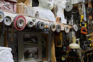 Artisan Workshop featuring Various Tools and Intriguing Sculptures and Artistic Creations photo