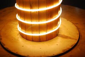 This stunning Illuminated Wooden Column features captivating Circular Lighting Effects photo