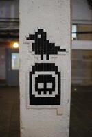A Unique Pixel Art Mosaic Creating a Striking Contrast on an Urban Wall for All to See photo