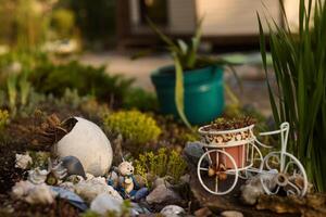 Beautiful and Charming Garden Scene with Various Decorative Elements and Artistic Touches photo