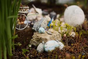An Enchanting Miniature Garden Featuring Colorful Decorative Stones and Various Elements photo