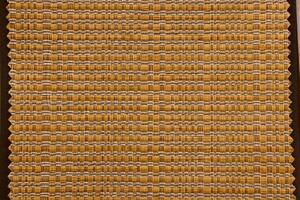 The beautifully textured weave pattern features warm earthy tones that create an inviting ambiance photo