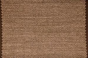 A Textured Brown Fabric Background Perfectly Suited for Various Design Projects and Ideas photo