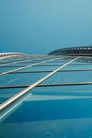 Modern Architecture A Stunning Glassy Skyscraper Showcased at a Striking Dramatic Angle photo