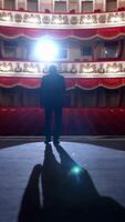 Empty raws in theater. Actor bows down in front of empty auditorium. Cancellation of mass events to prevent spread of coronavirus infection. Vertical video