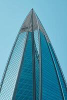 A Modern Skyscraper Soaring High While Pointing to the Sky with Incredible Design photo