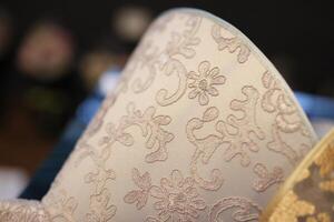 An Elegant and Decorative Fabric featuring an Intricate Lace Pattern that captivates the eye photo