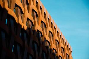Modern architecture with a distinctive patterned facade enhances urban aesthetic appeal photo