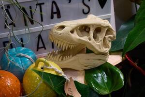 Dinosaur Skull Decoration with Brightly Colored Ornaments and Vibrant Plants for Display photo