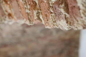 A CloseUp View of a Weathered Brick Texture and Structure Displaying Unique Features photo