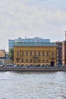 A Historic Building Coexists with Modern Architecture by the Scenic Riverbank Environment photo