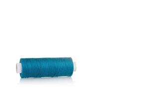 a skein of threads of blue color macro on a white background photo