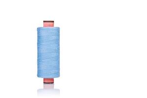 a skein of threads of blue color macro on a white background photo