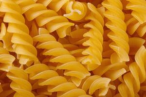 Pasta products in the form of a spiral, texture photo