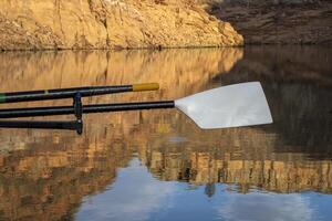 oars of coastal sculling shell in sandstone canyon of Horsetooth Reservoir in Colorado in fall scenery photo