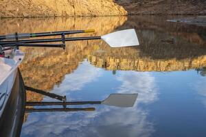 oars of coastal sculling shell in sandstone canyon of Horsetooth Reservoir in Colorado in fall scenery photo