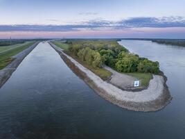 upstream entry to the Chain of Rock Bypass Canal from the Mississippi River above St Louis, aerial view at October dawn photo