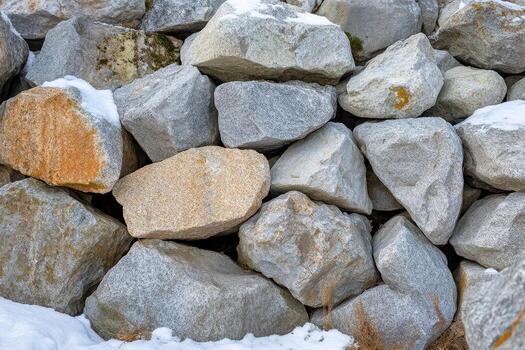 A pile of rocks in the snow photo