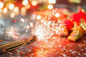 A sparkler is lit with a red candle photo
