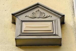 A mailbox on a wall photo