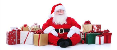 Santa claus sitting on the floor with many presents photo